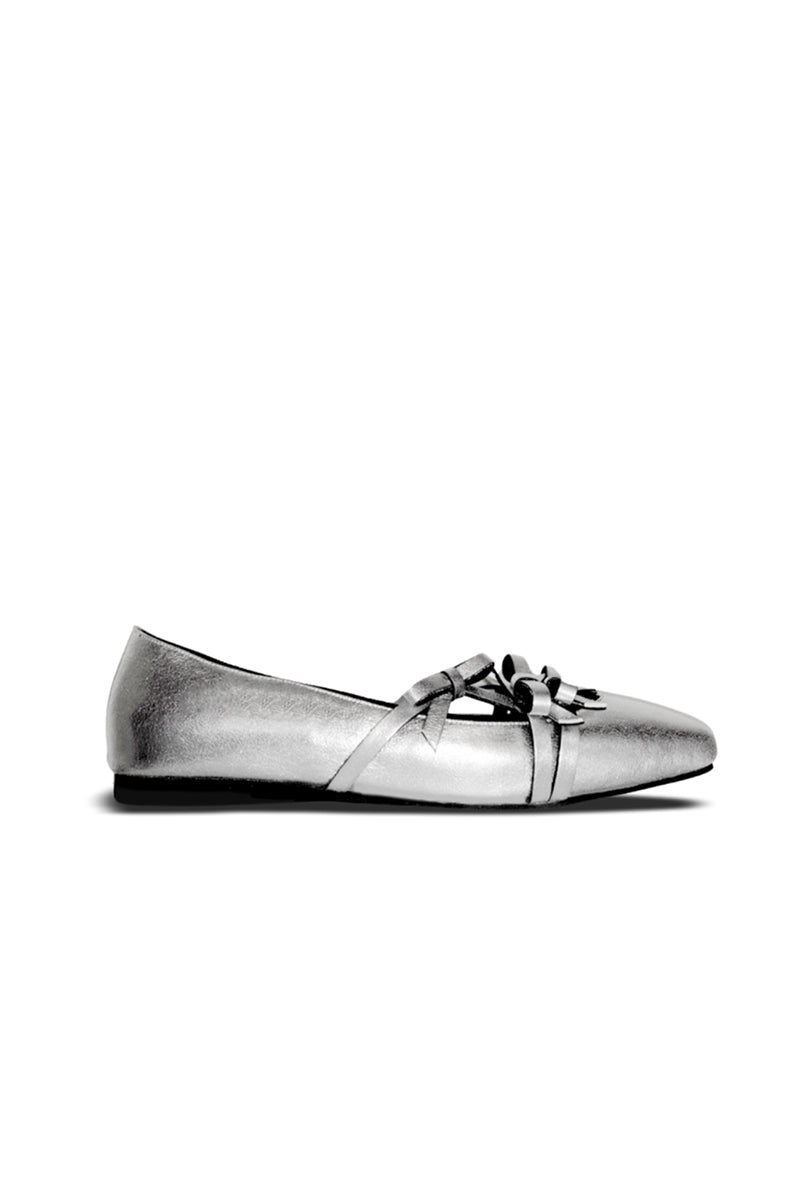 Side view of Christin Wu Annaya flats in silver, showcasing their sleek, pointed toe design and elegant slip-on style.
