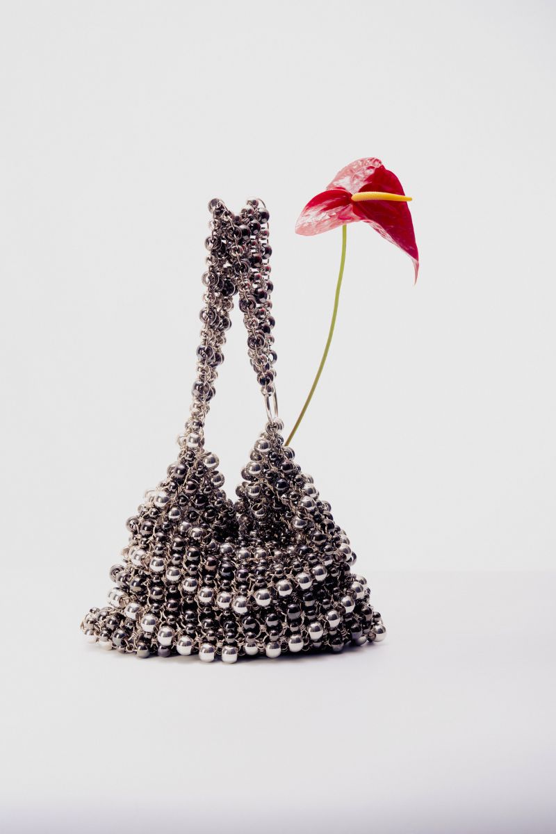 Silver Annie shoulder bag by Millanne Tale with pearl accents, featuring a sleek design and adjustable shoulder strap.