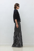 Hand embroidered anthrasite whale design maxi skirt by TAGG, featuring intricate embroidery on flowing fabric.