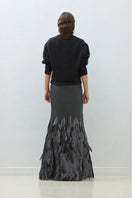 Hand embroidered Anthrasite whale design maxi skirt by TAGG, featuring intricate embroidery on flowing fabric.