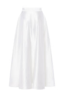 Podyh Iris midi skirt in cloud white, lightweight fabric with a flowy silhouette, displayed on a hanger against a neutral background.