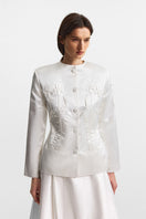 PODYH IRIS jacket in Cloud White with a sleek, lightweight design, shown on a hanger with a minimalist background.