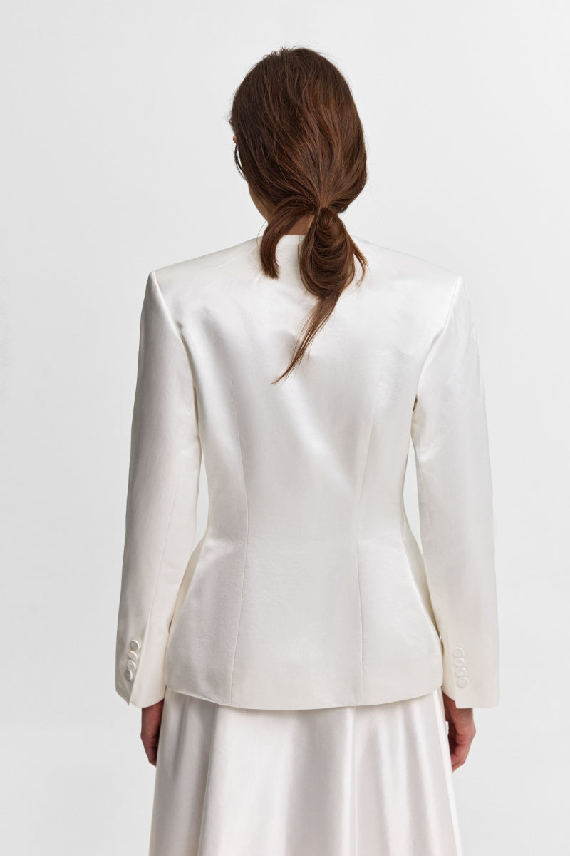 PODYH Iris jacket in Cloud White, lightweight jacket with a relaxed fit, shown on a hanger against a plain background.