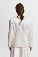 PODYH Iris jacket in Cloud White, lightweight jacket with a relaxed fit, shown on a hanger against a plain background.