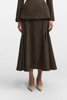 Podyh Seccesia midi skirt in rich brown, shown in a natural flowing style, with a high-waisted design and elegant fabric.