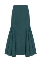 Podyh Secessia teal midi skirt with a flowy silhouette and subtle pleats, styled for elegant casual wear.