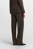 Podyh Seccesia brown pants featuring a relaxed fit and stylish design, displayed on a mannequin against a neutral background.