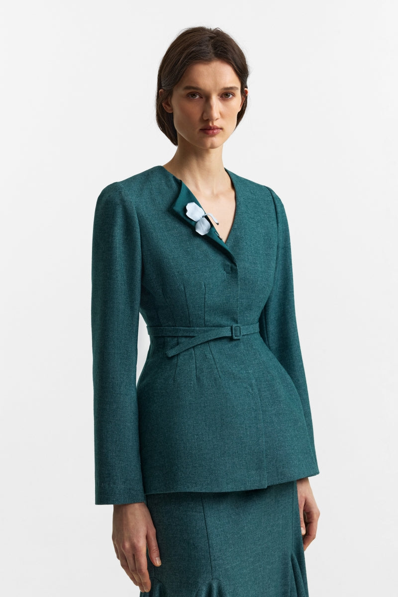 PODYH Secessia blazer in rich teal, tailored blazer with a structured fit and classic lapel, displayed on a hanger.
