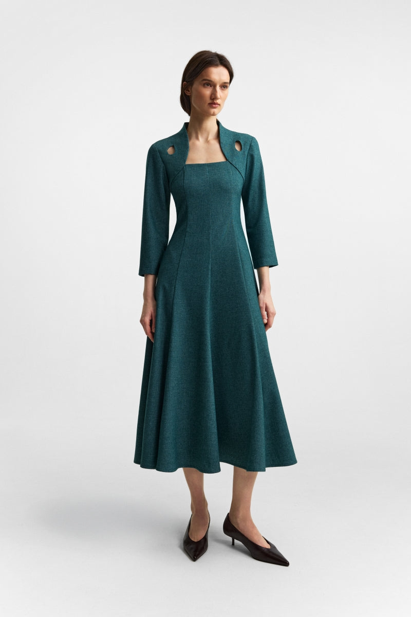 Podyh Edicule teal midi dress displayed on a hanger, showcasing its elegant design and rich teal color.