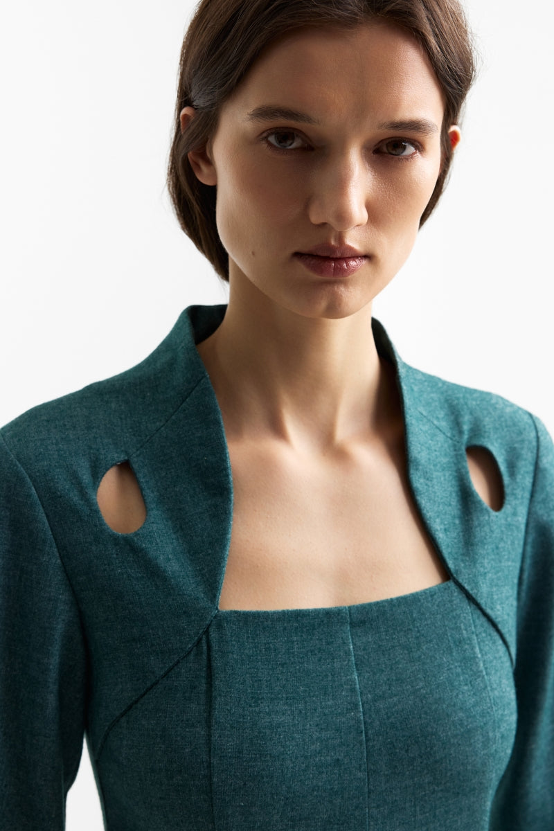 Podyh Edicule teal midi dress displayed on a hanger, showcasing its elegant design and rich teal color.