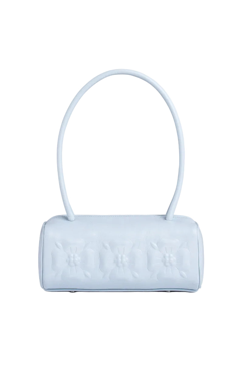 Ice blue PODYH top handle bag with bas relief design, showcasing the stylish bag's textured surface and elegant shape.