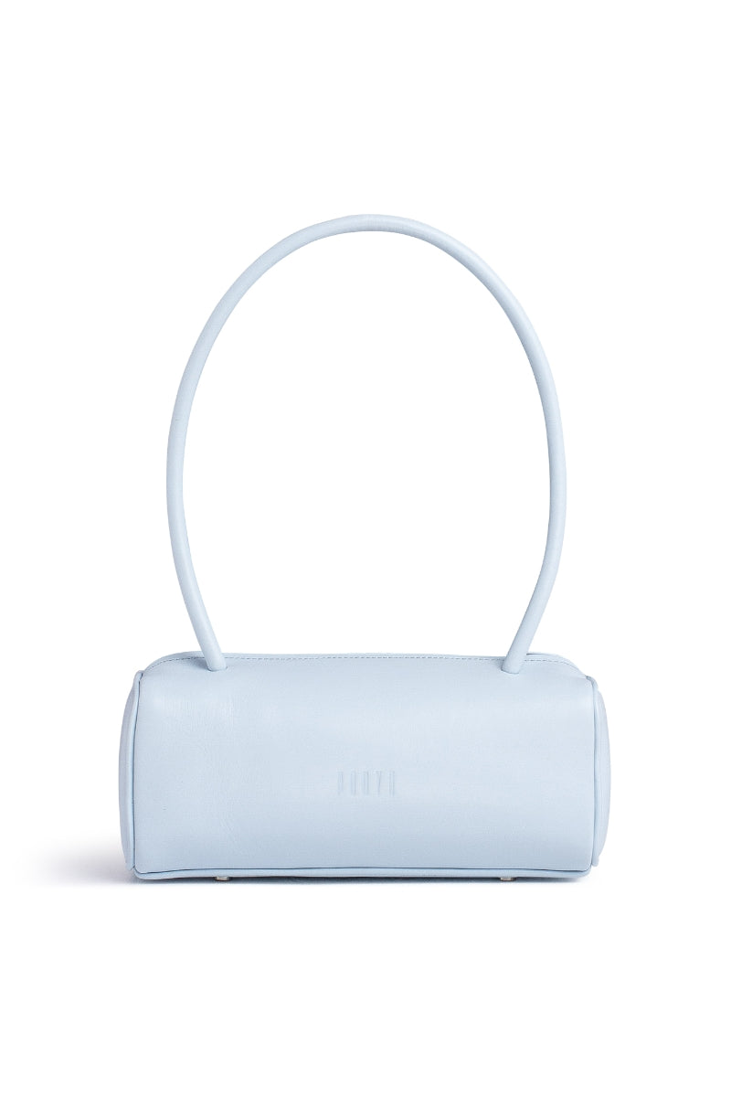Ice blue PODYH top handle bag with bas relief design, showcasing a stylish and textured bag front view.