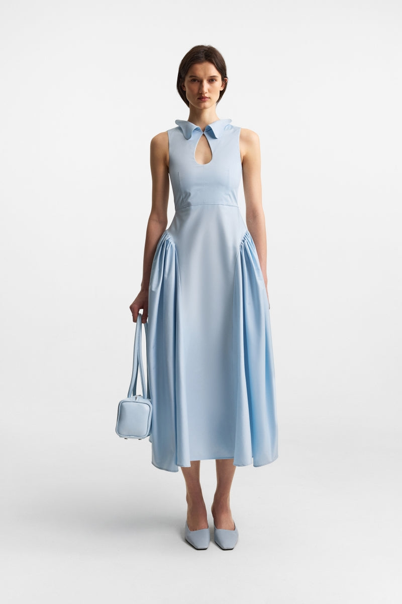 Ice blue PODYH top handle bag with bas relief design, showcasing a stylish and elegant accessory for everyday use.