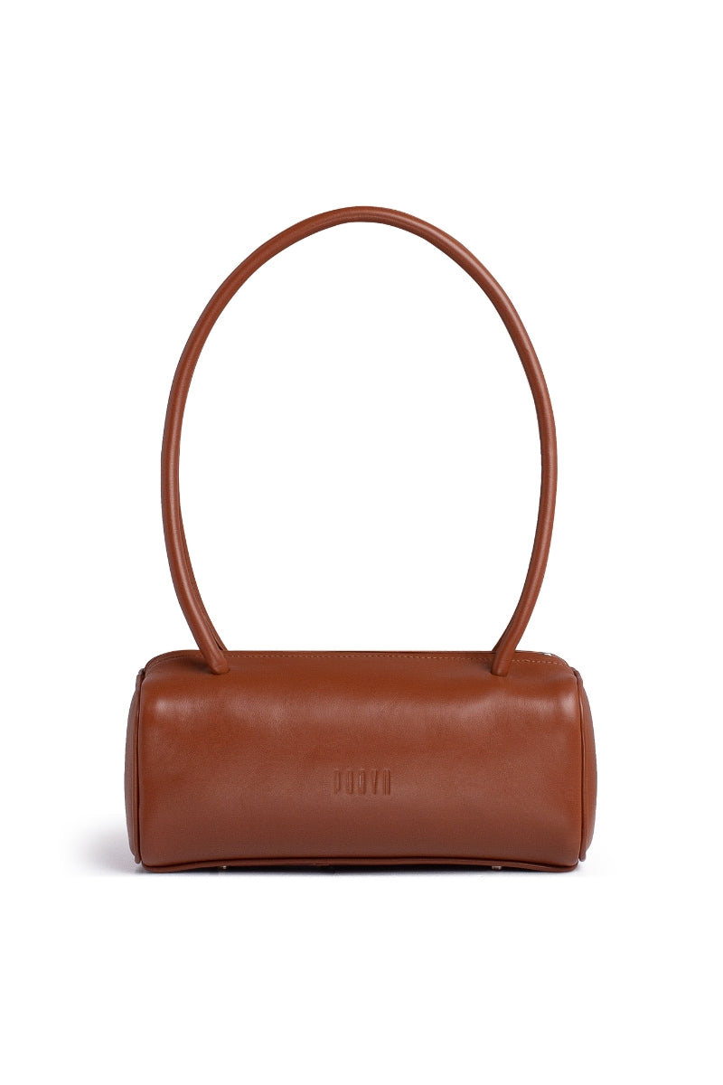 Brown PODYH top handle bag with a detailed bas relief design, showcasing elegant craftsmanship and stylish accessory features.