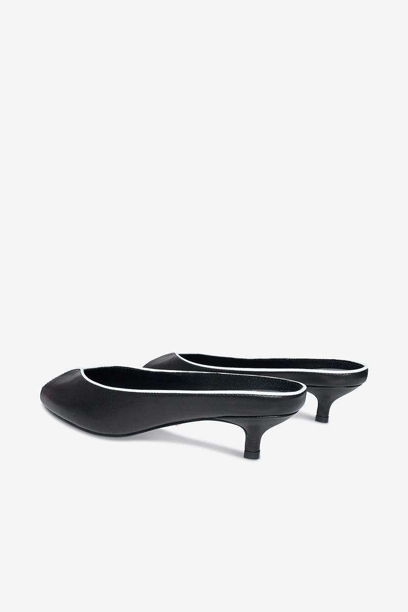 Black AQUILA heels by 10TH FLOOR, stylish women's high-heeled shoes with a sleek design and pointed toe.