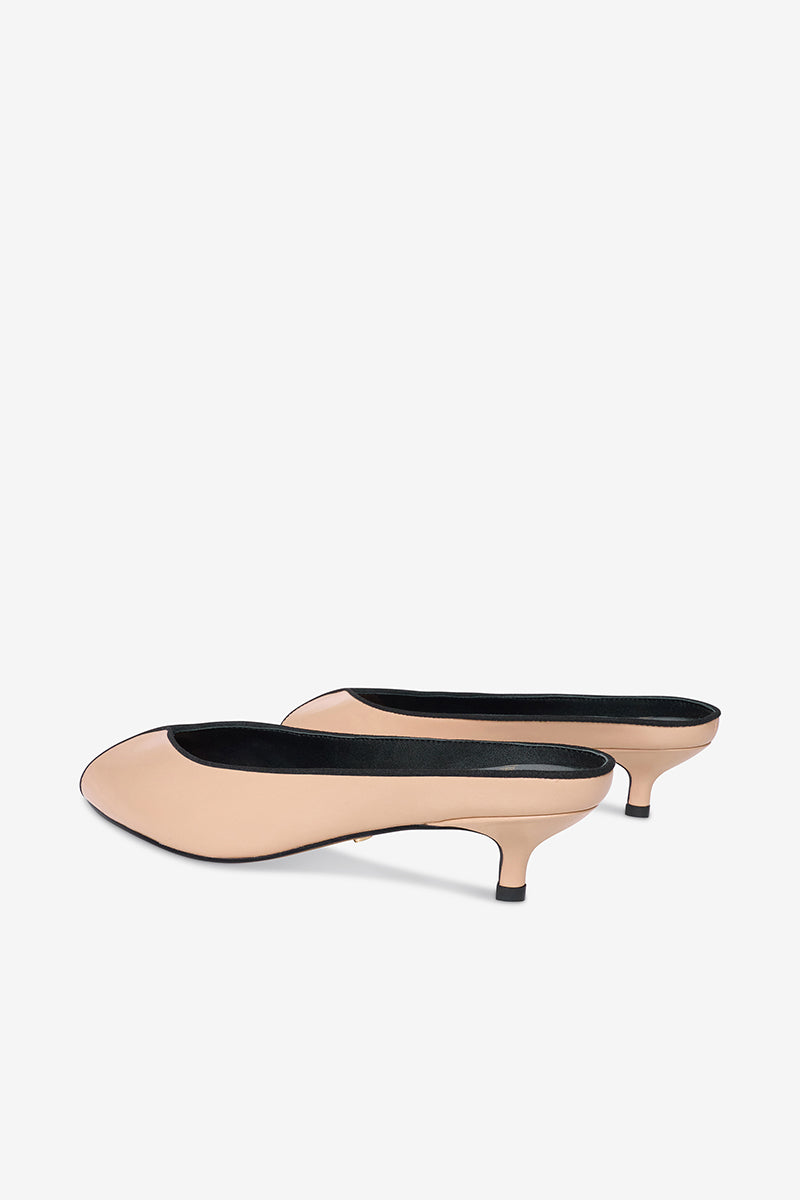 Black AQUILA heels in sand color by 10TH FLOOR, stylish women's shoes with ankle straps and pointed toes.