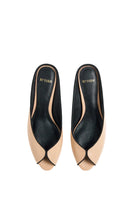 Pair of black AQUILA heels in sand color by 10TH FLOOR, showcasing stylish high-heeled footwear with sleek design.