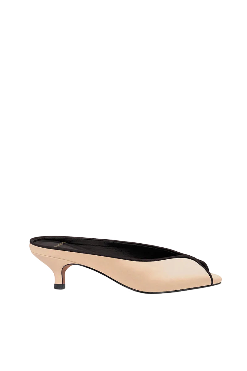 10th Floor Aquila heels in sand color with stylish straps, showcasing the elegant open-toe design and block heel.
