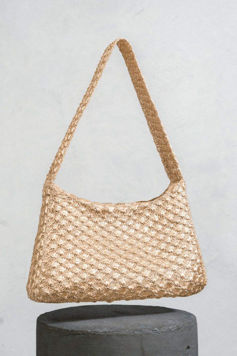 Gold Arista seashell shoulder bag by VERDI with textured seashell design and elegant strap, perfect for stylish accessories.