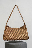 Antique brass Arista seashell shoulder bag by Verdi featuring a detailed seashell design and elegant craftsmanship.