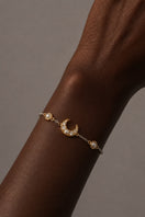 Silver and gold Luna Two Tone Pearl Moon Bracelet by Amelia Scott featuring a sleek, elegant design with pearl accents.