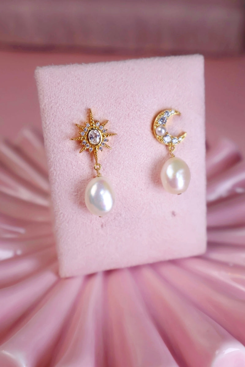 Gold baroque pearl stud earrings featuring moon and star designs by Amelia Scott, showcasing elegant jewelry craftsmanship.