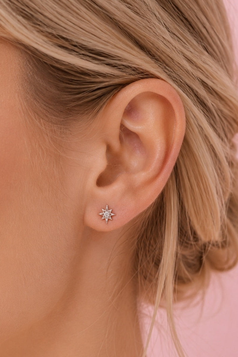 Silver and clear ZIGGY MINI NORTH STAR stud earrings by Amelia Scott, featuring a sleek star design with sparkling details.