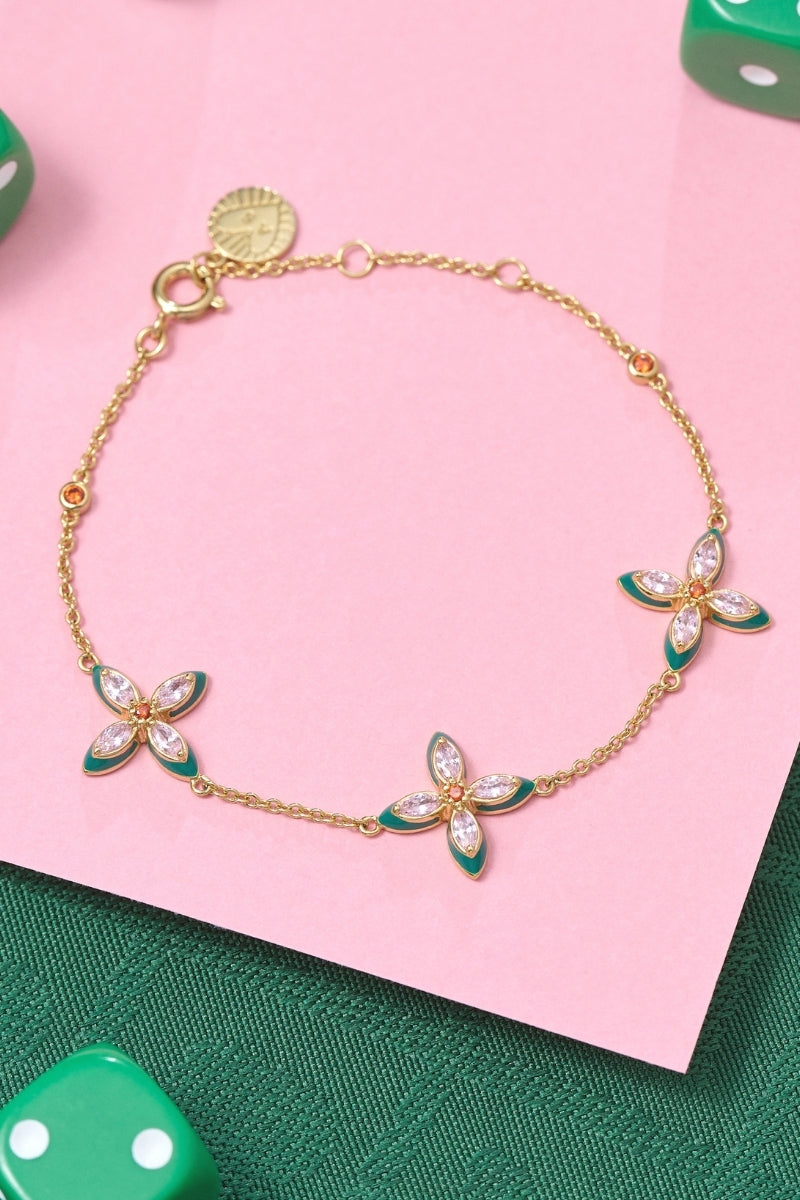 Amelia Scott Lucky Clover bracelet with four-leaf clover charms on a delicate chain, stylish jewelry accessory.