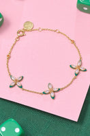 Amelia Scott Lucky Clover bracelet with four-leaf clover charms on a delicate chain, stylish jewelry accessory.