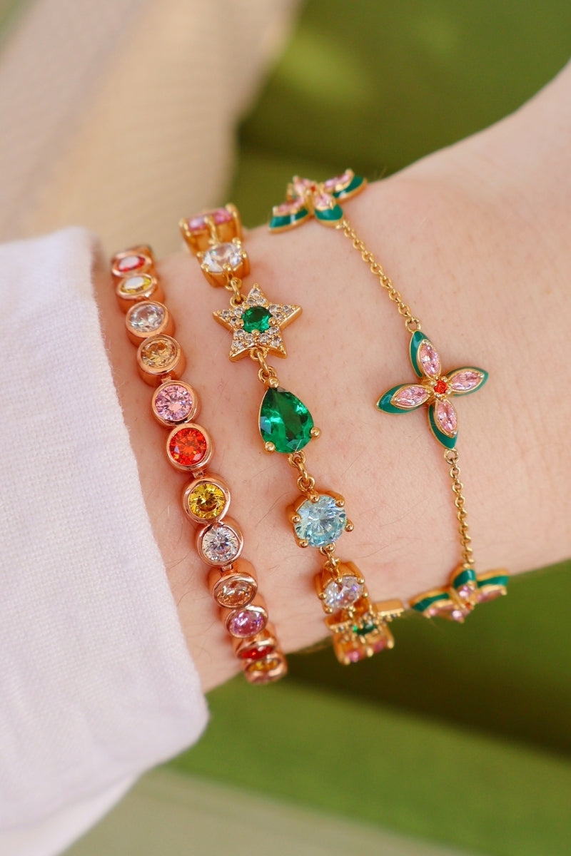 Silver lucky clover bracelet by Amelia Scott featuring four-leaf clover charms on a delicate chain.