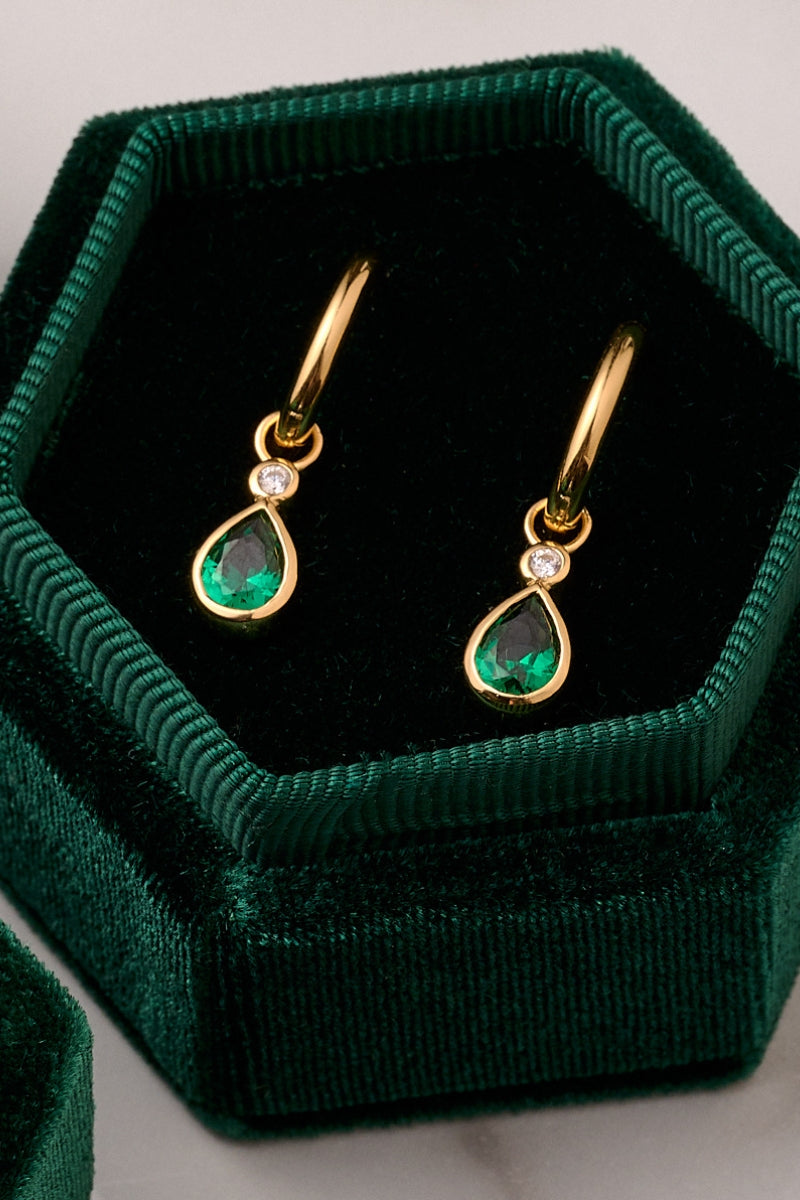Emerald green and gold Sofia teardrop hoop earrings by Amelia Scott, featuring a sleek teardrop shape with elegant gold accents.