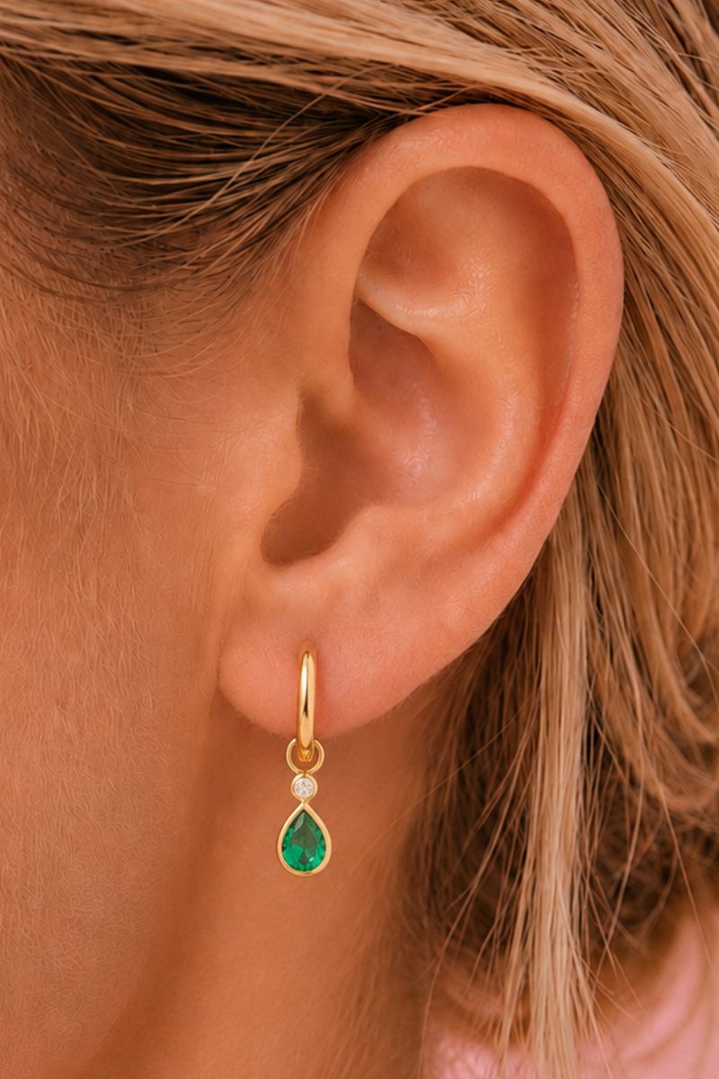 Emerald green and gold Sofia teardrop hoop earrings by Amelia Scott, featuring elegant teardrop-shaped hoops with intricate gold accents.