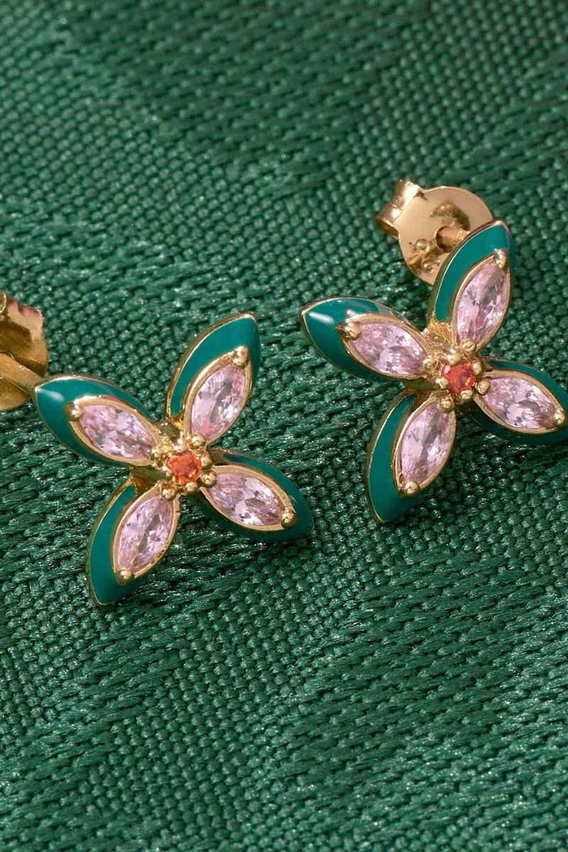 Amelia Scott Lucky Clover Stud Earrings featuring four-leaf clover design in gold-tone metal, close-up view of the jewelry.