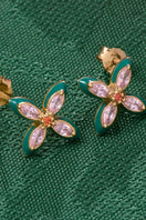 Amelia Scott Lucky Clover Stud Earrings featuring four-leaf clover design in gold-tone metal, close-up view of the jewelry.