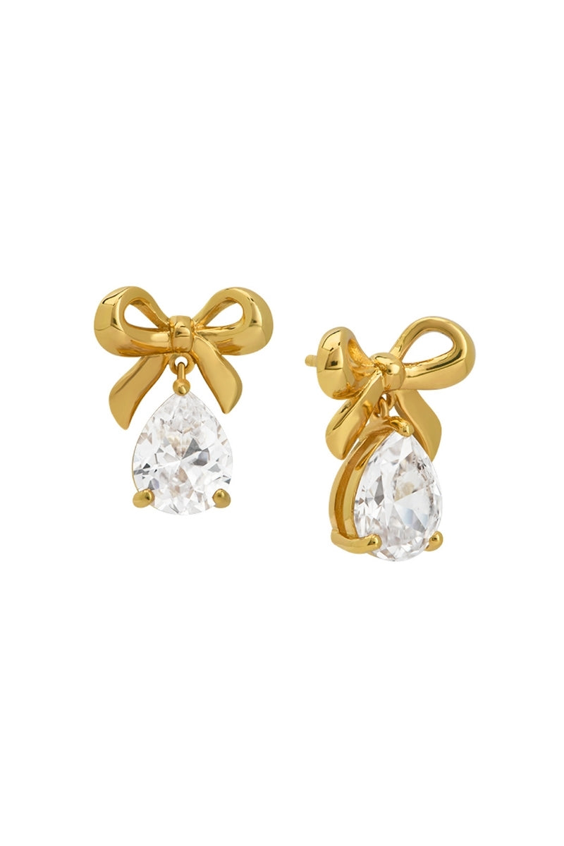 Gold Amelia Scott bow stud earrings with clear cubic zirconia stones, showcasing a delicate and elegant jewelry design.
