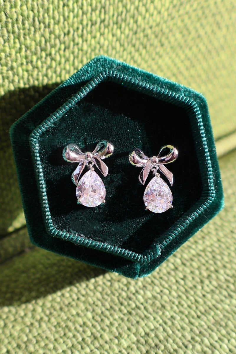 Silver Amelia Bow Stud Earrings by Amelia Scott, featuring small bow designs on classic earring posts.
