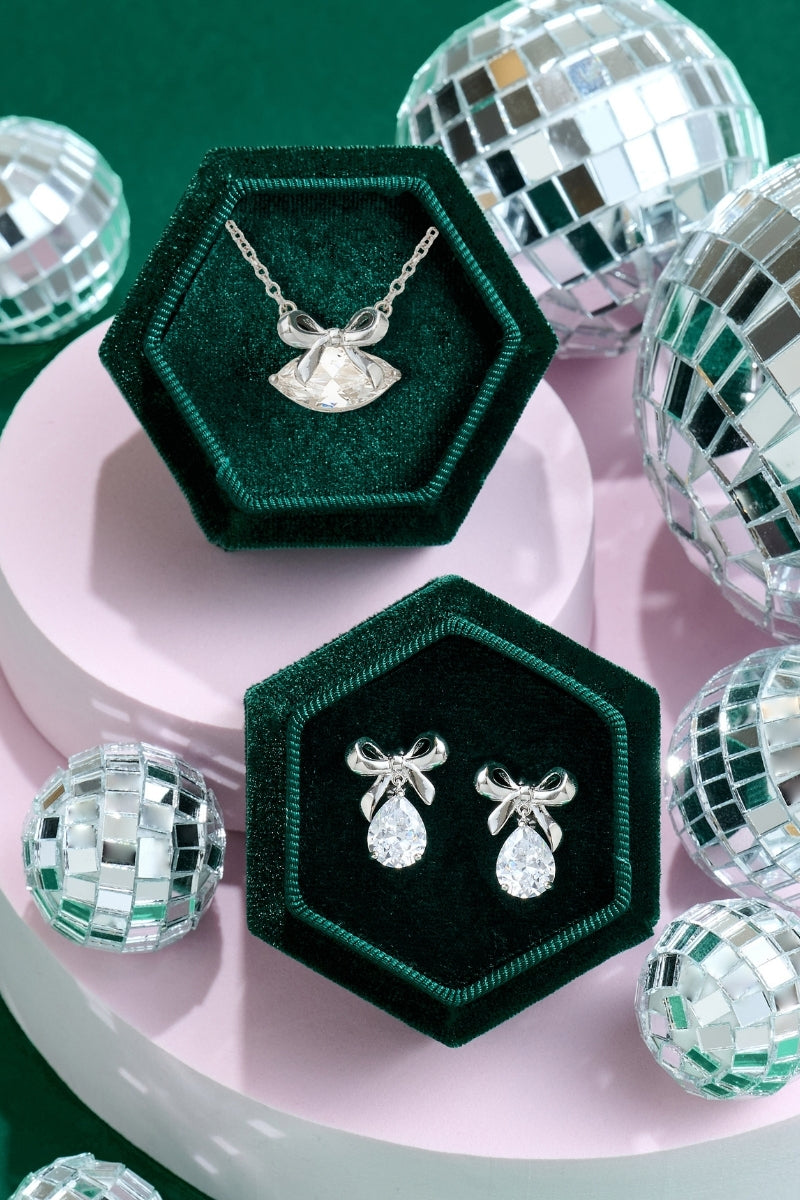 Silver Amelia Scott bow stud earrings with delicate, polished design, perfect for everyday wear and adding subtle elegance.