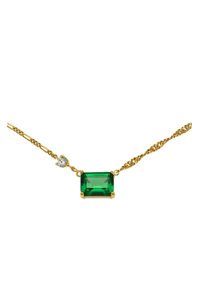 Emerald green and gold necklace by Amelia Scott featuring intricate design, displayed on a neutral background.
