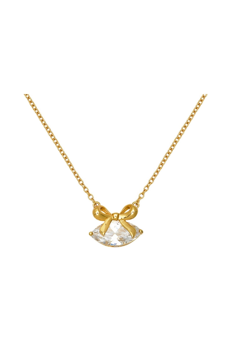 Gold Amelia Scott necklace with clear cubic zirconia bow pendant, elegant jewelry piece for stylish accessorizing.