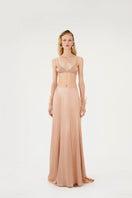Nude ASIM silk maxi skirt by Mastani, flowing fabric with a smooth, elegant silhouette, displayed on a plain background.