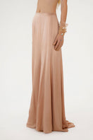 Nude ASIM silk maxi skirt by Mastani, flowing and elegant with smooth fabric and a relaxed fit, perfect for stylish summer wear.