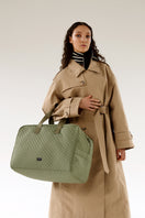 Olive green ASK Scandinavia Ella overnight bag with top handles, made from durable material, featuring a spacious interior and sleek design.
