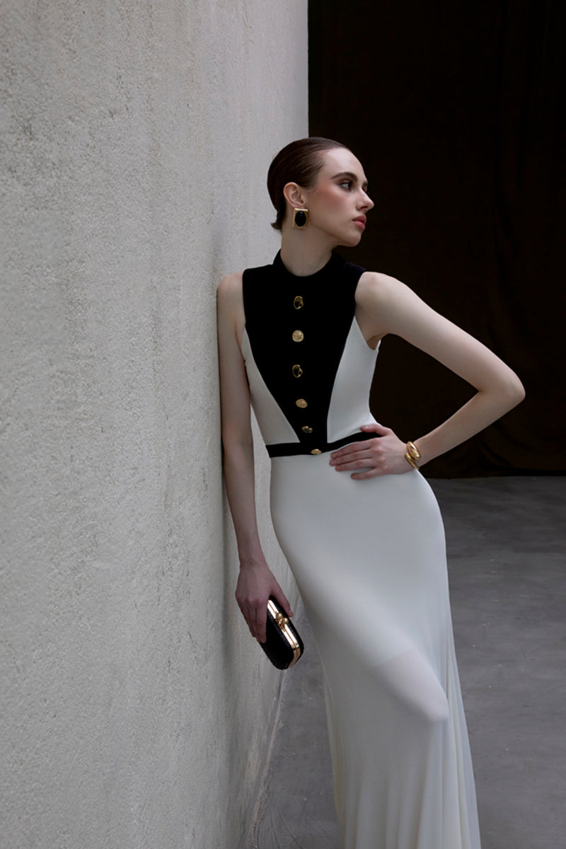 Jenny K Tran Aster dress in ivory and black gown, elegant design with flowing fabric and intricate detailing.