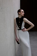 Jenny K Tran Aster dress in ivory and black gown, elegant design with flowing fabric and intricate detailing.
