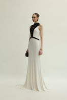 Jenny K Tran Aster gown in ivory and black, flowing dress with elegant design and intricate details, perfect for formal occasions.