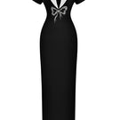 Black Sweetheart Bowtie Long Dress by HACCHIC COUTURE featuring a fitted bodice, bowtie detail, and flowing skirt.