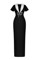 Black Sweetheart Bowtie Long Dress by HACCHIC COUTURE featuring a fitted bodice, bowtie detail, and flowing skirt.