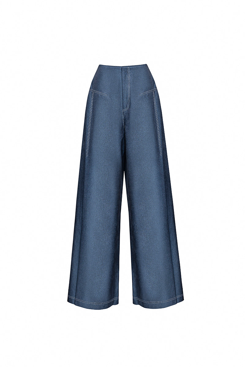 Jenny K Tran ATLAN PANTS I in blue denim, featuring a relaxed fit and classic jean style, visible on the model.
