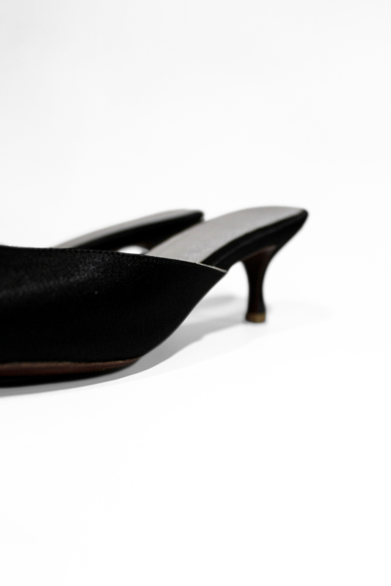 Black Audrey kitten heel by Christin Wu, featuring a sleek design with a pointed toe and low heel for elegant comfort.