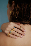 Colorful multi-stone Aurora ring by PERACAS featuring a modern design, set in a sleek ring band with vibrant gemstone accents.